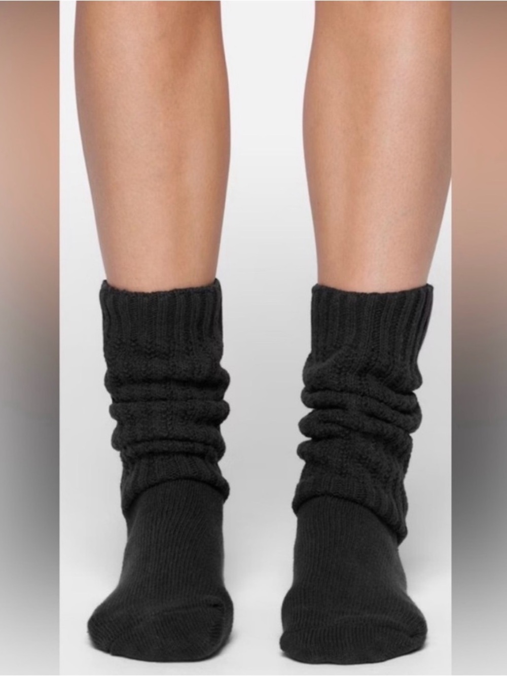 Skims slouchy socks in soot black